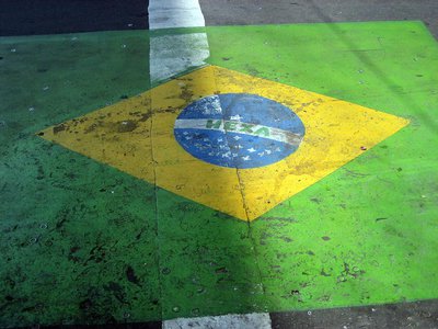 A street painting of Brazil’s flag with the word ‘Hexa’ (‘Sixth’) representing Brazilian aspirations to win its sixth World Cup title in 2014. Such aspirations disappeared much faster than will the paint. Photo: Killian Doherty