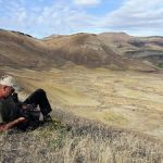 Tim Lewis checks his camera at John Day as he returns from filming in Pilot Rock, Oregon. Photo: Mark Stafford.