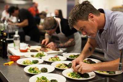 Belly owner and chef Brendan Mahaney prepares plates in the may 31 heat of Iron Chef Eugene. Photo courtesy LCC.