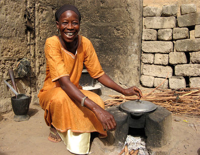 A woman in Senegal with an improved cookstove. Photo: CREATE!