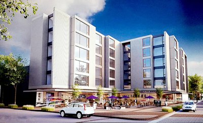 A rendering of Kesey Square with apartments added above Voodoo Doughnut and Northwest Persian Rugs from ‘Option A’ of Ali Emami’s RFEI proposal. Emami says the square would remain public and the design of the apartments is flexible.