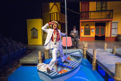 Tony rust (in boat) and mark allen in cottage theatre’s Scapino!