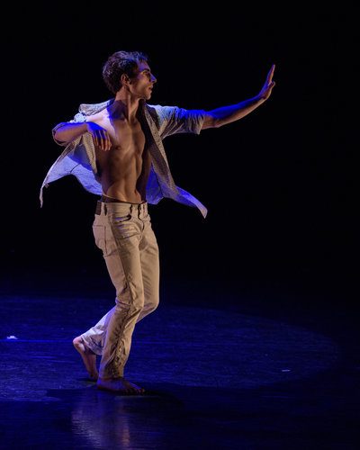 Lane Community College student Tristan Giannini performs a repertory piece by Merce Cunningham.